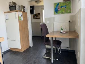 Kuchyň nebo kuchyňský kout v ubytování Birkenhain 2a - Lastering Ferienhäuser & Apartments