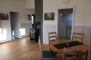 Et tv og/eller underholdning på Fichtenhain - Lastering Ferienhäuser & Apartments + 7 billeder