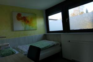 Postel nebo postele na pokoji v ubytování Haselbusch - Lastering Ferienhäuser & Apartments