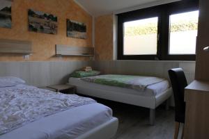 Postel nebo postele na pokoji v ubytování Haselbusch - Lastering Ferienhäuser & Apartments