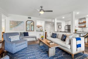 a living room with a couch and a table at 4821 Turtle Cove Villa by Akers Ellis Rentals in Kiawah Island
