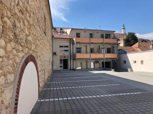 a brick walkway in front of a building at Apartment Vyhlídka in Mikulov