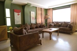 a living room with couches and a coffee table at Park 12 in Kavaklıdere