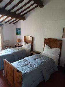 Postel nebo postele na pokoji v ubytování Pilgrim Rooms