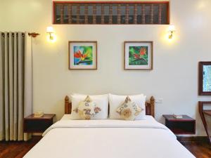 Rúm í herbergi á Sala Noble Siem Reap
