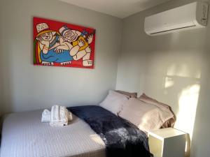 a bedroom with a bed and a painting on the wall at Ville Acqua Park in Bragança +14 photos
