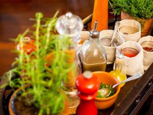 a table with a bunch of plants and bottles at Kurotel Centro Contemporâneo de Saúde e Bem Estar in Gramado