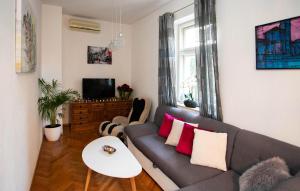 a living room with a couch and a table at Awesome Home In Split in Split