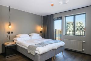 Voodi või voodid majutusasutuse Blomlöfs Hotell Saltö toas