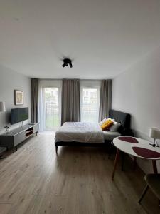 Postel nebo postele na pokoji v ubytování Platon Residence Apartments