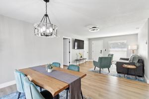 a dining room and living room with a table and chairs at Luxury getaway, relax, and recharge! in Spring Hill
