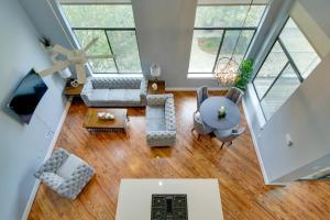 an overhead view of a living room with wood floors at Spacious EaDo Getaway Less Than 1 Mi to Toyota Center! in Houston