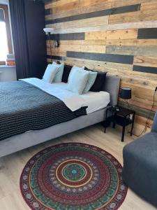 Posteľ alebo postele v izbe v ubytovaní Apartament nad Wilgą
