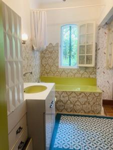 a bathroom with a sink and a window at Maison de famille en Provence in Rognes +15 photos