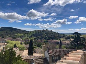 a view of a town from the roofs of houses at Maison de famille en Provence in Rognes