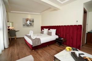 Voodi või voodid majutusasutuse NJ Hotel Rabat toas