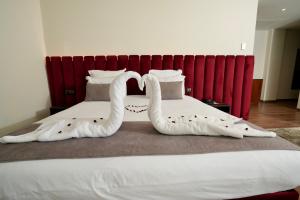 Voodi või voodid majutusasutuse NJ Hotel Rabat toas