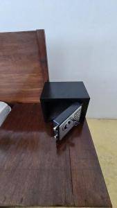 a black box sitting on top of a wooden table at Equalia boutique hotel in Jambiani