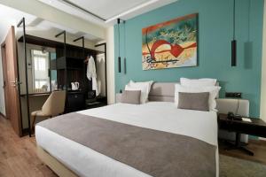 Voodi või voodid majutusasutuse NJ Hotel Rabat toas