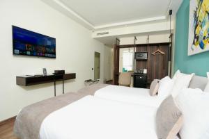 Voodi või voodid majutusasutuse NJ Hotel Rabat toas