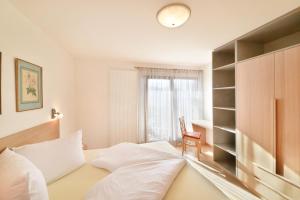 Posteľ alebo postele v izbe v ubytovaní Haus Rosengarten