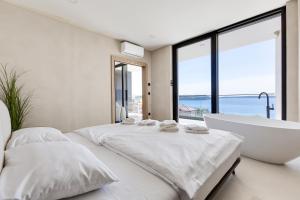 Postel nebo postele na pokoji v ubytování Apartina Boutique Suites