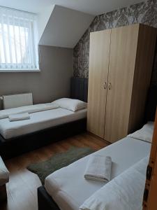 Postel nebo postele na pokoji v ubytování Ubytovanie Tri sestry