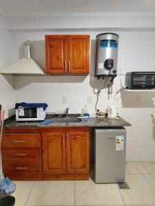 Η κουζίνα ή μικρή κουζίνα στο Departamento amoblado DC