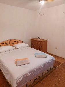 Postel nebo postele na pokoji v ubytování Apartmani Branko