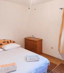 Postel nebo postele na pokoji v ubytování Apartmani Branko