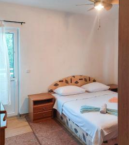 Postel nebo postele na pokoji v ubytování Apartmani Branko