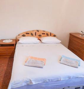 Postel nebo postele na pokoji v ubytování Apartmani Branko