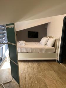 Postel nebo postele na pokoji v ubytování Pitoresk Alaçatı
