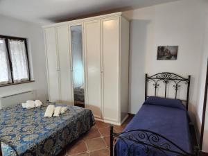 a bedroom with a bed with two pillows on it at Residenza Giscor in Gasponi