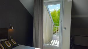 Voodi või voodid majutusasutuse Best Western Hotel Acadie Paris Nord Villepinte toas