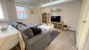 TV a/nebo společenská místnost v ubytování Avenida de Arteixo. Precioso apartamento