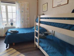 Postel nebo postele na pokoji v ubytování Ekeliden B&B