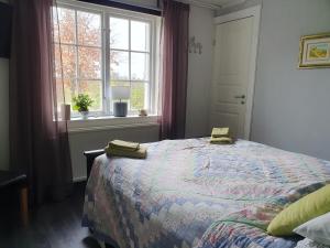 Postel nebo postele na pokoji v ubytování Ekeliden B&B