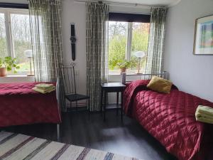 Postel nebo postele na pokoji v ubytování Ekeliden B&B