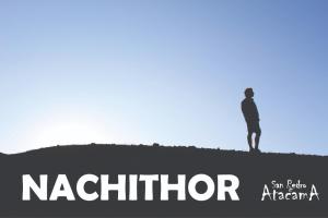 a man standing on top of a hill at Cabaña Nachitor in San Pedro de Atacama