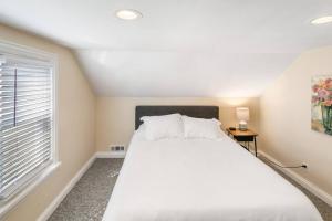 a bedroom with a large bed and a window at Home with Garage in DT Libertyville Near Naval Base in Libertyville