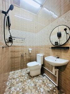 a bathroom with a toilet and a sink at 7Pax BM大山脚 Singlestorey Alma 8minute to Aeon mall in Bukit Mertajam