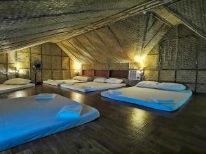 Voodi või voodid majutusasutuse Mansueto's Beach Resort toas