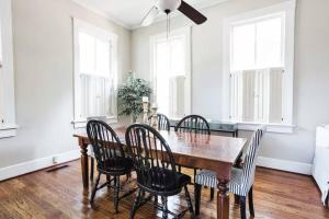 a dining room with a wooden table and chairs at Charming 2Bed 2Bath Bungalow Shandon in Columbia