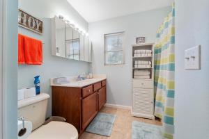 a bathroom with a toilet and a sink at LOTO BREEZE 2 in Sunrise Beach +32 photos