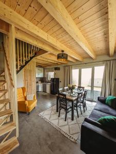 a living room with a table and chairs at Beskidzka Kraina in Porąbka +56 photos