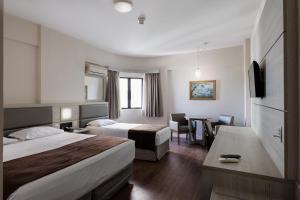 Ένα ή περισσότερα κρεβάτια σε δωμάτιο στο Hotel D'sintra +38 φωτογραφίες