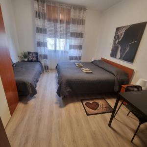 Postel nebo postele na pokoji v ubytování Appartamento Orchidea