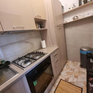 Kuchyň nebo kuchyňský kout v ubytování Appartamento Orchidea