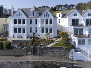 an aerial view of a white house at Dolly's Plaice, Fowey in Fowey